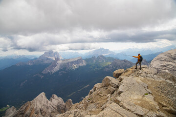 Hiker enjoys the view from Tofana di Mezzo in the italian Dolomites.