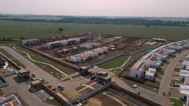 Aerial Landscape of Colombian Suburbs Under Construction. New Developing Suburban Area. Pull Back