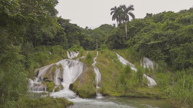 Large waterfall, one of El Nicho cascades in Cumanayagua, Cuba, cloudy weather
