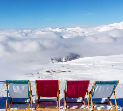 sunbeds for relaxation, beautiful winter landscape of Gudauri ski resort in Georgia with mountain view