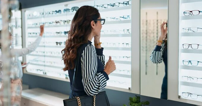 Woman, optometry and choosing glasses for eye care, consultation and optometrist with shopping retail. Female person, spectacles and option in clinic or ophthalmology center for size, frame and lens