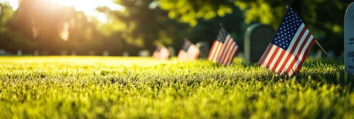 American flags placed at military graves during sunrise. A scene of remembrance and honor for Memorial Day.