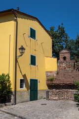 street in fortified town Montecarlo in Lucca, Tuscany, Italy. Picturesque historic medieval buildings make attractive destination for tourists to visit. 
