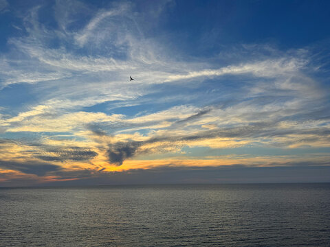 Sea and sky with sunset clouds. 