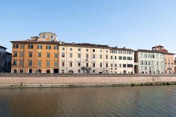 Naklejka premium residential city houses and apartments on road Lungarno Gambacorti with river Arno in Pisa, Italy