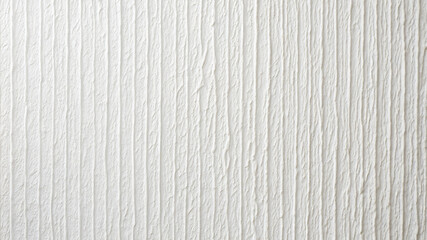 Fototapeta premium A close-up view of a textured white wall showcases vertical lines and subtle grooves that add depth and visual interest to a minimalist interior