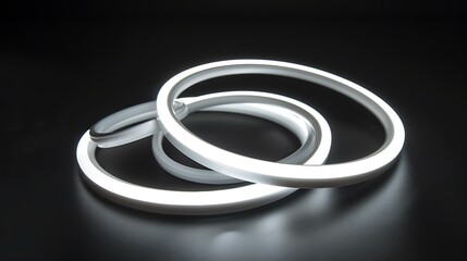 Naklejka premium White LED Strip Lights in Circular Shapes on a Black Background