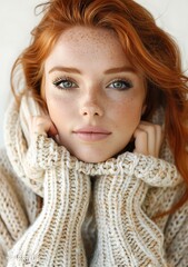 Close Up Portrait of a Young Woman with Red Hair and Freckles Wearing a Knit Sweater