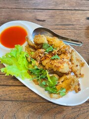 Deep fried fish with garlic and yellow turmeric.