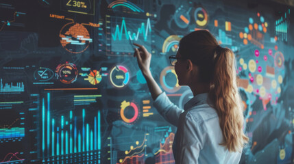 Innovative ideas presented on a digital display while a woman analyzes data in a modern office setting
