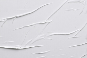 Fototapeta premium Textured white paper surface for glued poster design.