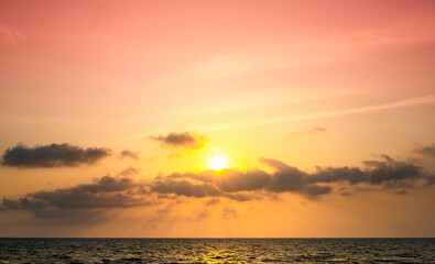 Nature of the beach and sea Summer with sunshine, sandy beaches, clear blue waters sparkling against the sunset sky. On an island with good ecology and environment Background for summer vacation conce