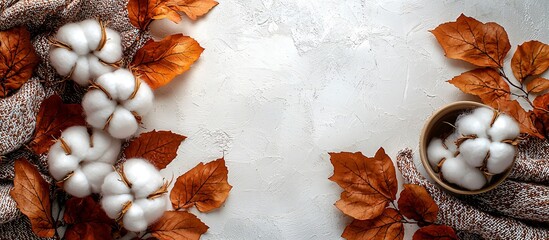 A serene still life of cotton bolls and autumn leaves, perfect for Thanksgiving and Halloween decor, enhancing seasonal festivities and gatherings.