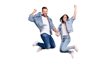 Photo of rejoicing overjoyed nice charming couple wearing jeans denim jackets enjoying their free...