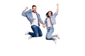 Photo of rejoicing overjoyed nice charming couple wearing jeans denim jackets enjoying their free time in summer while isolated with blue background