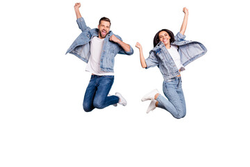 Photo of overjoyed joyful cute nice couple of spouses jumping flying in air happily while isolated...