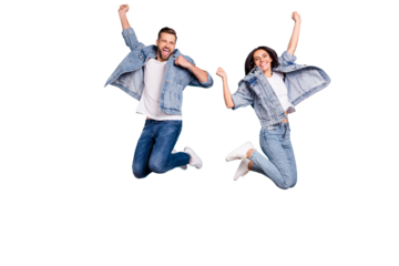 Photo of overjoyed joyful cute nice couple of spouses jumping flying in air happily while isolated with blue background