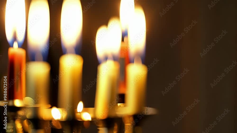 Poster Golden candelabra with several candles burning, creating a warm and inviting atmosphere perfect for the cold winter months