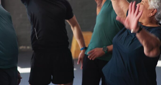 People, fitness and huddle for motivation in gym, training and together for workout progress. Group, teamwork and trainer for class diversity celebration, energy and hands for support in exercise