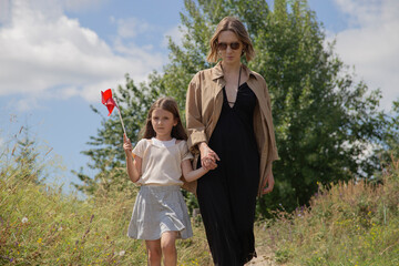 A mother and daughter enjoying a serene afternoon