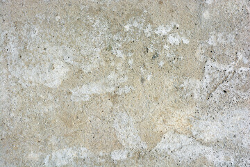 Building materials, gray original cement, light brown background with small irregularities and hollows.