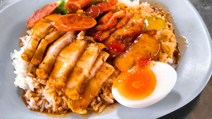 Crispy pork rice on a blue plate on the dining table