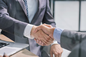 Businessman handshake for teamwork of business merger and acquisition