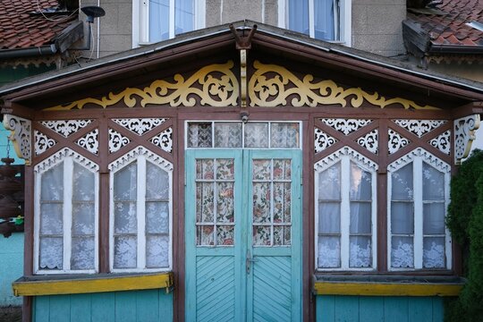Rychliki, Poland - 22 September 2024: Decorative wooden porch of old building in Rychliki village in Warmia