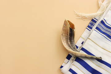 religion image of shofar (horn) on white prayer talit. Rosh hashanah (jewish New Year holiday),...