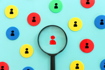 image of cubes with people figures and magnifying glass, human resources, leadership and management...