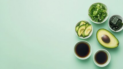 A collection of fresh ingredients for a meal, including avocado, greens, and sauces.