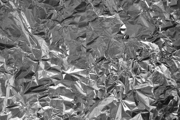 Processed collage of shiny metal silver gray foil crumpled packaging material texture