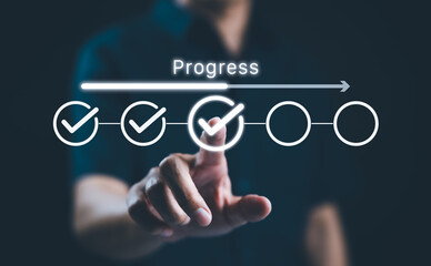 Businessman touches a digital progress checklist with check marks and an advancing loading bar,...