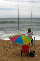 Man fishing on the beach
