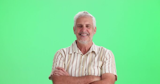 Mature, man and confident with face on green screen for advertising education, learning and knowledge. English teacher, arms crossed and happy in studio for career in teaching, professional and pride