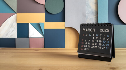 Black calendar with colorful geometric shapes, March 2025, planning and organization. 
