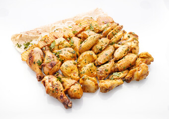 Deliciously grilled chicken pieces served on a platter with fresh herbs and lemon slices, perfect for outdoor gatherings or family feasts