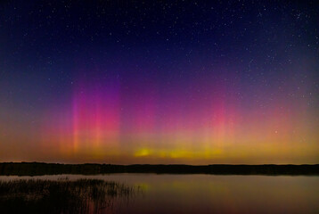 Northern Lights (Aurora Borealis) lighting up the sky on a beautiful warm summer night near Ottawa, Canada Sept 12, 2024