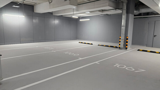 Concrete empty car parking, gray room of multi level parking with spaces for car, parking in building for safe storage of personal vehicle