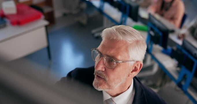 Professor, man and writing on board for education, curriculum and learning in top view. Mature lecturer, talk and teaching in university with students on computer for IT, software and coding lesson