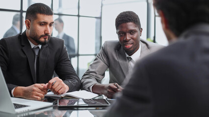 Businessman explaining to colleagues at a meeting in the office