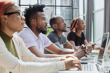 African american team working at call center office to help people with telemarketing assistance