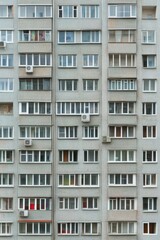 Fototapeta premium Facade of a Grey Multi-storey Panel building in Russia, Soviet architecture houses