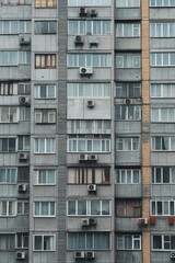 Facade of a Grey Multi-storey Panel building in Russia, Soviet architecture houses