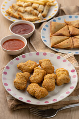Golden Chicken Nuggets and Tasty Sides on a Table