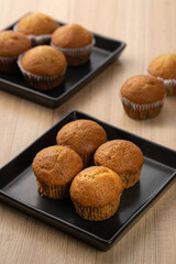 Freshly Baked Muffins on Black Plates