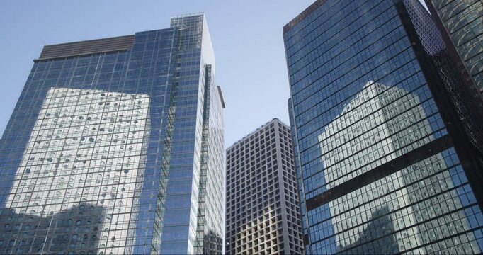 Modern Glass Skyscrapers in Hong Kong Business District with Blue Sky
