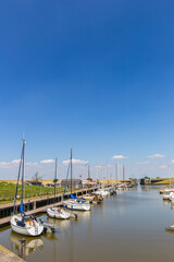 Sailing yachts in the harbor of Termunterzijl, Netherlands