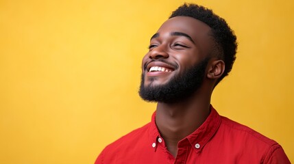 Obraz premium Portrait of a happy handsome man in a shirt with laughing