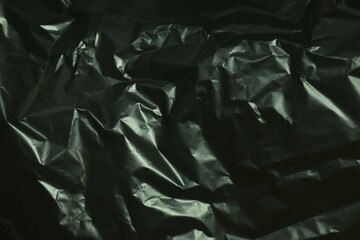 close up of black plastic garbage bag texture and background